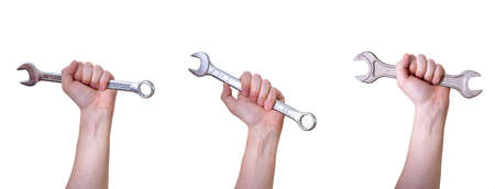 A collage of hands with wrenches on a white background. repair tools.の写真素材