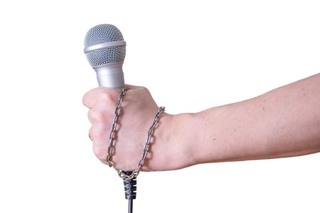 Female hand with microphone, on white background. World Press Freedom Day.の写真素材