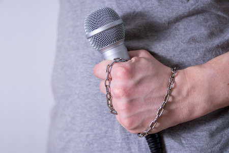 Dynamic microphone close-up on dark background. World Press Freedom Day.の写真素材