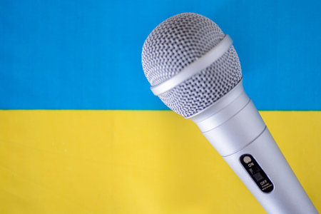Microphone with national flag on background series - Ukraine. The concept of World Press Freedom...