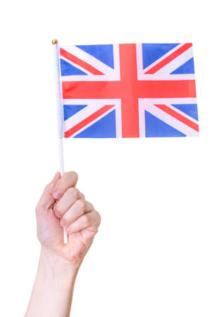Hand holding flag of UK, isolated on white background. The concept of a great country.の写真素材