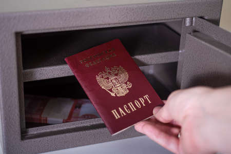Russian passport in the safe with rubles. Russian passport under sanctions.の写真素材