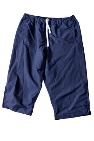 The dark blue shorts are isolated on a white background. The concept of sale, shopping and fashion for short pants.の写真素材