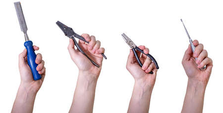 Hands holding hand tools, insulated on white background. Tool elevator, chisel and pliers.の写真素材