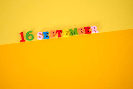 September 16 on a yellow paper background with space for text. Mexican Independence Day concept.の写真素材