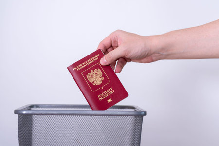 Passport of the Russian Federation in a trash can. The man throws the passport into the trash....