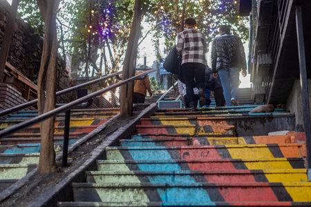 Istanbul, Turkey, January 22, 2023. An alley of colorful stairs between stone walls leading to the...