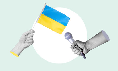 Art collage, collage of a hand holding the flag of Ukraine, microphone in the other hand. Concept of an interview with Ukraine on a light background.の写真素材
