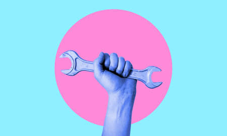 art collage. Hand with a wrench in neon. Concept of technical support, warranty service, and repair.の写真素材