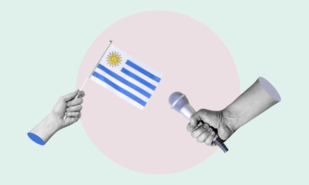 Art collage, collage of a hand holding the flag of Uruguay, microphone in the other hand. Concept of an interview with Uruguay on a light background.の写真素材