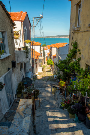 Narrow streets in a Turkish city on a summer and sunny day with old and masonry wooden houses. The concept of old and beautiful architecture as well as tourism and travel.の写真素材
