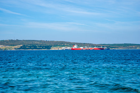A large merchant ship off the coast of Turkey. The concept of business and finance.の写真素材
