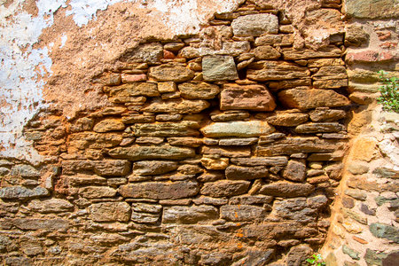 Ancient medieval stone wall texture background. The concept of architecture and texture.の写真素材
