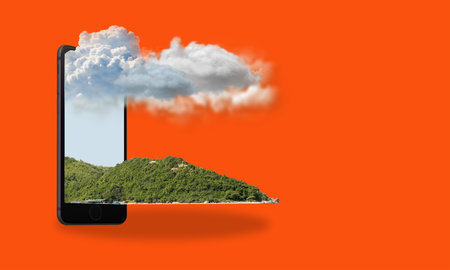 Digital collage of contemporary art. Phone, with mountains and sky on a red background with spice copies. Concept of travel and tourism.の写真素材