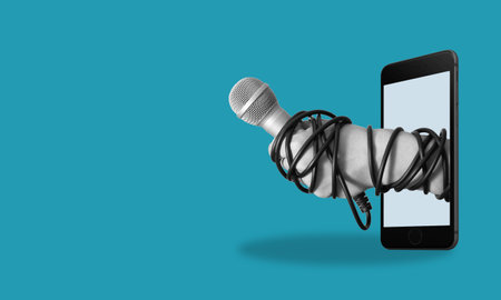 Modern art collage, the hand with phone microphone, on blue background Concept of interview or news with room for advertising.の写真素材