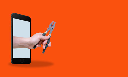 Service and repair center app, mobile technician call, remote work. Tools in the hands of a specialist, on the smartphone screen in your hand. minimalist collageの写真素材