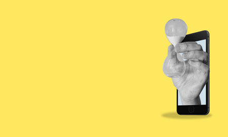 Creative abstract template graphic collage image of a cell phone with an hourglass on a yellow background with space for text. advertising concept.の写真素材