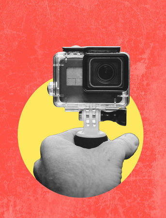 Art collage, a hand with a video camera filming itself. The concept of blogging and filming.の写真素材