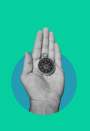 Compass in a human's hand. Business development in the right direction. art collage.の写真素材