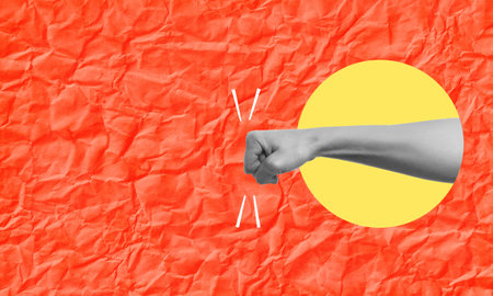 art collage. The fist is a metaphor for aggression and confrontation, a strong blow in a place to copy. The concept of advertising on a red background.の写真素材
