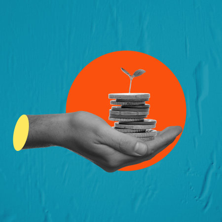 Art collage, hand with coins on a blue, wet paper background. Concept of finance and economics.の写真素材