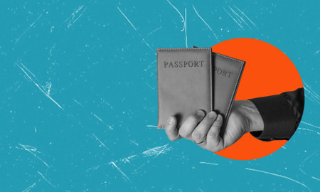 Art collage, hand with two passports on blue background with copying space. Concept of crossing the border with a passport.の写真素材