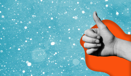 Art collage of hand showing thumbs up on blue background with copy space. The concept of a great mood.の写真素材