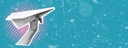 Hand-holding paper airplane on blue background with copy space. Ideas for traveling. Art collage.の写真素材