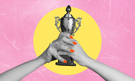 Champion cup, first place, first place trophy. The concept of an award in the hands of a person with copy space.の写真素材