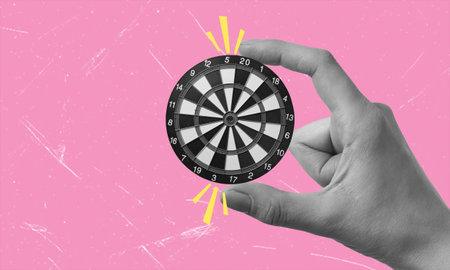 Contemporary art collage art depicting a hand holding a target. Concept of goal achievement,...