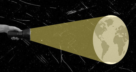 A hand holds a flashlight that projects the Earth onto a starry background, symbolizing exploration...