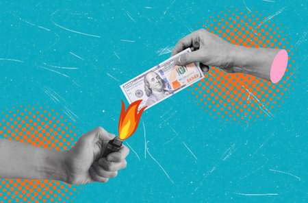 Modern art art collage image of money burning on a blue background. Concept of recession, inflation,...