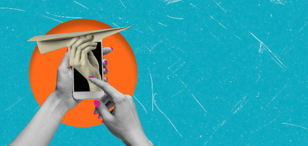 Two hands interact with a smartphone showcasing a paper airplane launch. A bright orange circle contrasts with a turquoise background, emphasizing creativity and playfulness.の写真素材