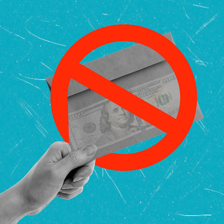 A hand is shown holding a dollar bill while a red no symbol covers the bill. This represents the idea of avoiding cash payments in various activities or transactions.の写真素材