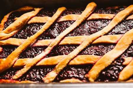 close-up pie with garden berries on black  backgroundの写真素材