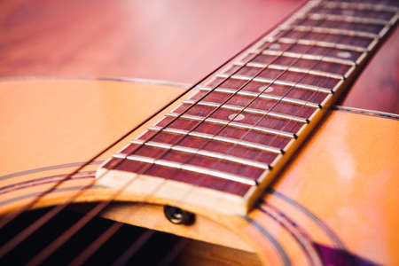 acoustic guitar detail  strings vulture on a light backgroundの写真素材