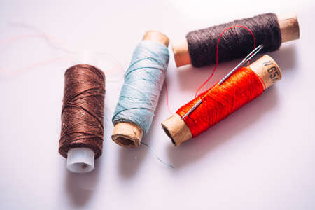 spool of thread on a light colored  backgroundの写真素材