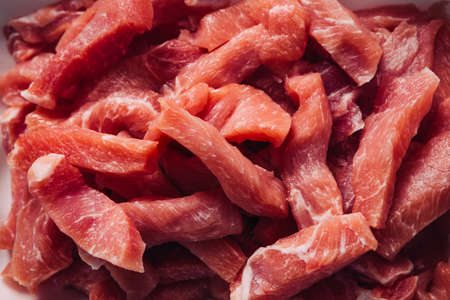 many pieces of  chopped fresh meat pork stroganoffの写真素材
