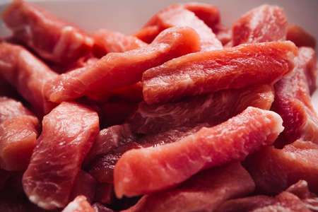 many pieces of  chopped fresh meat pork stroganoffの写真素材