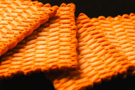 lots of fresh cookies on a dark background.の写真素材