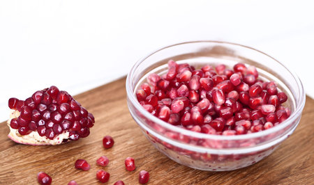 Garnet grains on wooden deskの写真素材