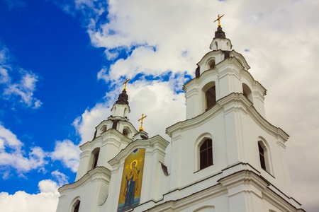 Golden dome of the Orthodox church in Central Russia on the blue sky backgroundの写真素材