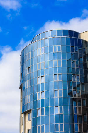 view to steel blue glass high rise building skyscraper, business concept of successful industrial architectureのeditorial素材