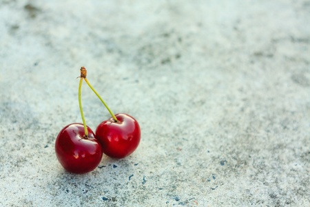 Cherries against gray backgroundの写真素材