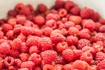 sweet fresh raspberries closeup background. Selective focusの写真素材