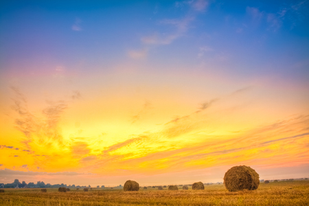 Sunrise field, hay bale in Belarus. Sunset, HDRの写真素材