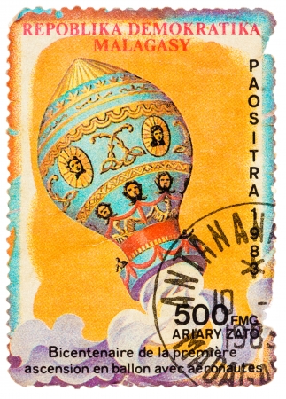 MALAGASY - CIRCA 1983: Stamp printed in the Malagasy shows bicentenary of the first balloon ascent with aeronauts, circa 1983のeditorial素材