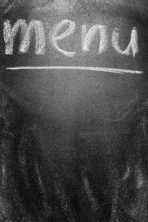 Menu title written with chalk on blackboardの写真素材