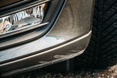 Black Bumper Car Scratched With Deep Damage To Paint.の写真素材