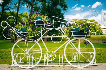 Decorative Vintage Model Of Old Bicycle Equipped With Basket Of Flowersの写真素材